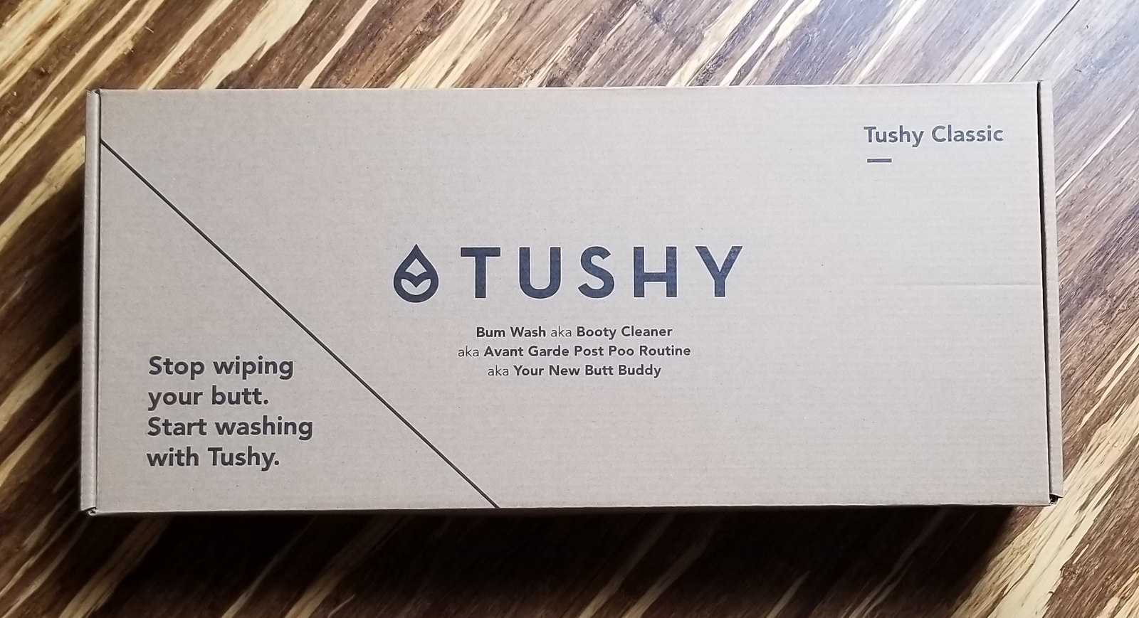 TUSHY plain kraft corrugated shipper box with irreverent brand copy