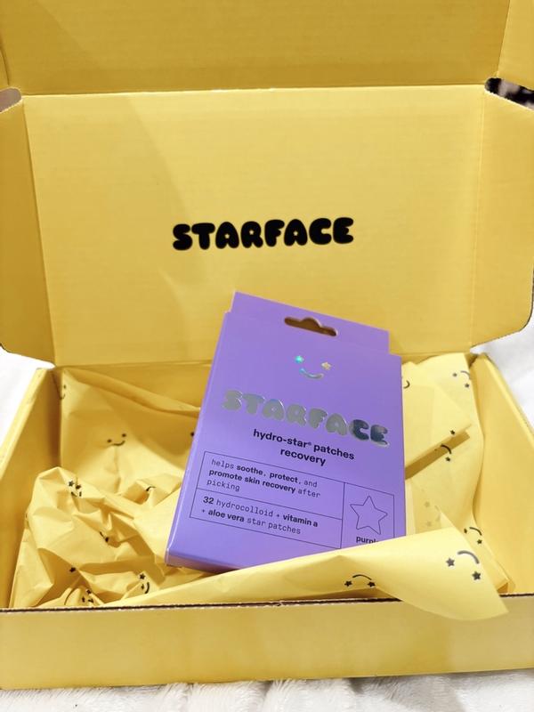 Starface canary yellow mailer box with custom star-and-smiley tissue paper and STARFACE stamp inside lid